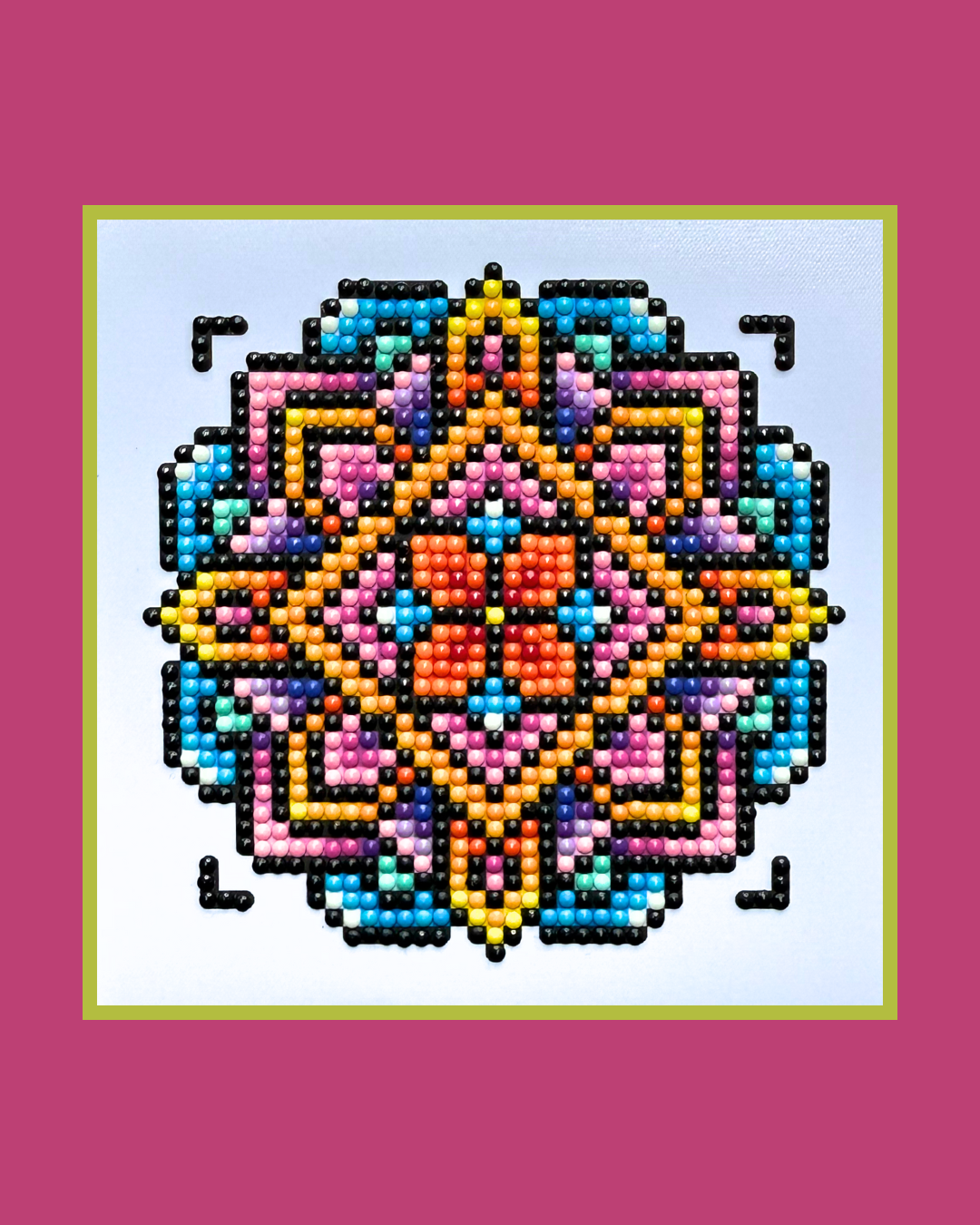 Colorful pixel art design on a white background with a pink border